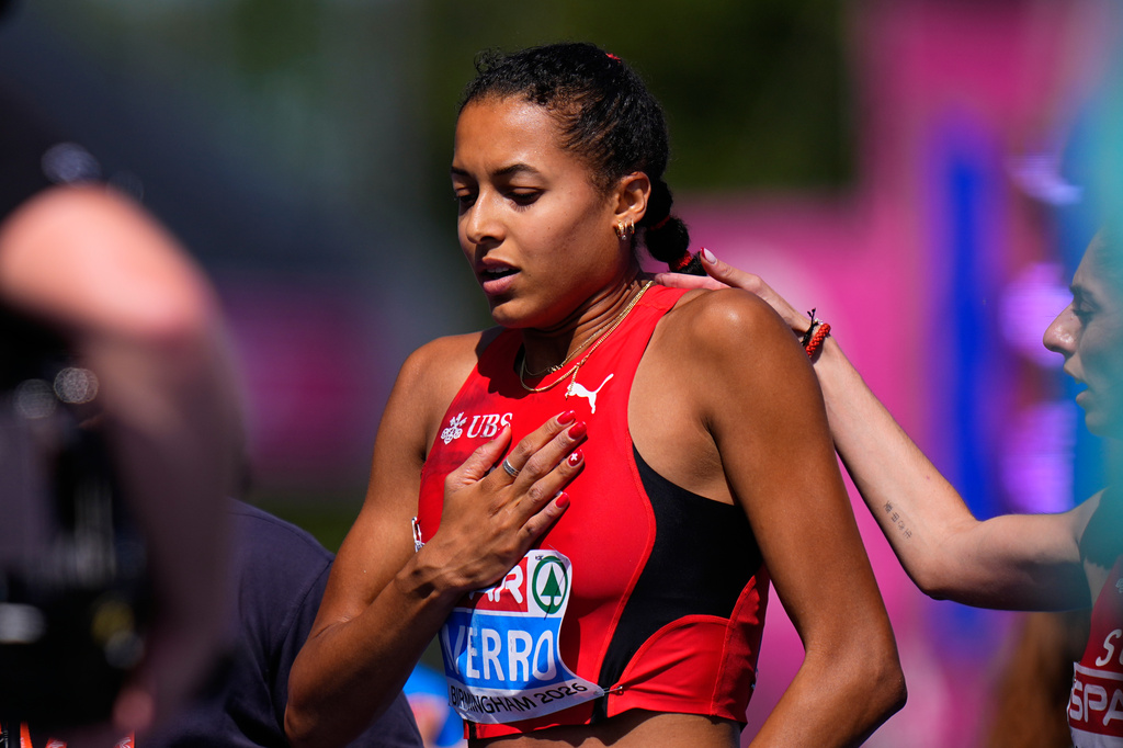 Switzerland's Audrey Werro reacts after crossing the finish line in last place after falling to the ground during a women's 800 meters semifinal at the European Athletics Championships in Birmingham, England, Thursday, Aug. 13, 2026. (AP Photo/Petr David Josek)