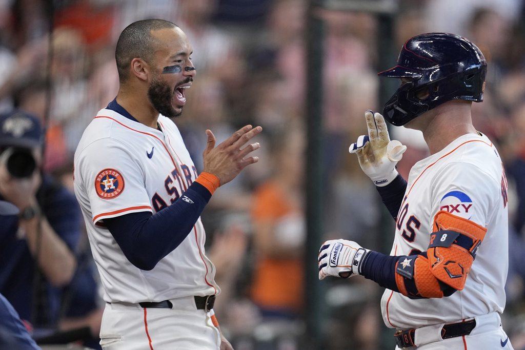 Houston Astros' Christian Walker, right, celebrates with Carlos Correa after hitting a home run against the Colorado Rockies during the eighth inning of a baseball game Thursday, Aug. 28, 2025, in Houston. (AP Photo/David J. Phillip)