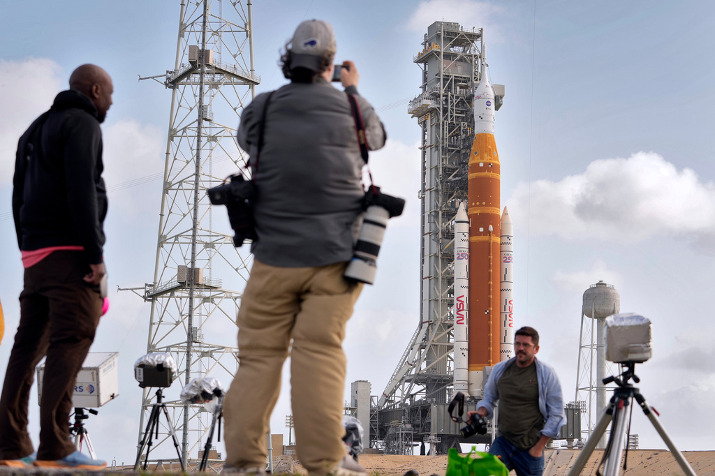 Photographers setup remote cameras near NASA's Artermis II moon rocket on Launch Pad 39-B at the Kennedy Space Center Sunday, March 29, 2026, in Cape Canaveral, Fla. (AP Photo/Chris O'Meara)