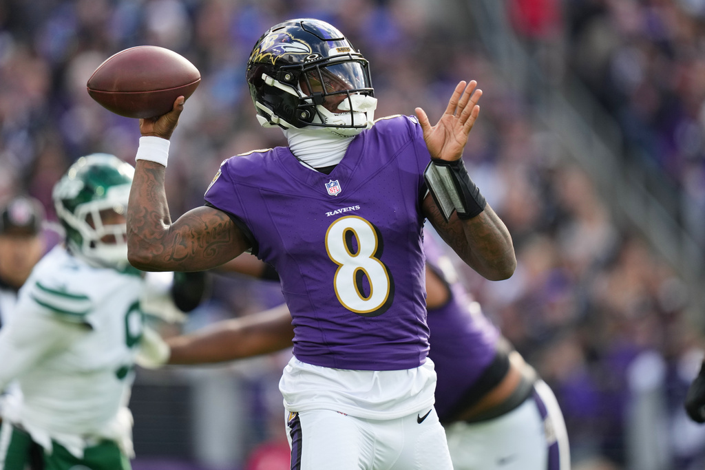 Baltimore Ravens quarterback Lamar Jackson stands back to pass during the first half of an NFL football game against the New York Jets, Sunday, Nov. 23, 2025, in Baltimore. (AP Photo/Stephanie Scarbrough)