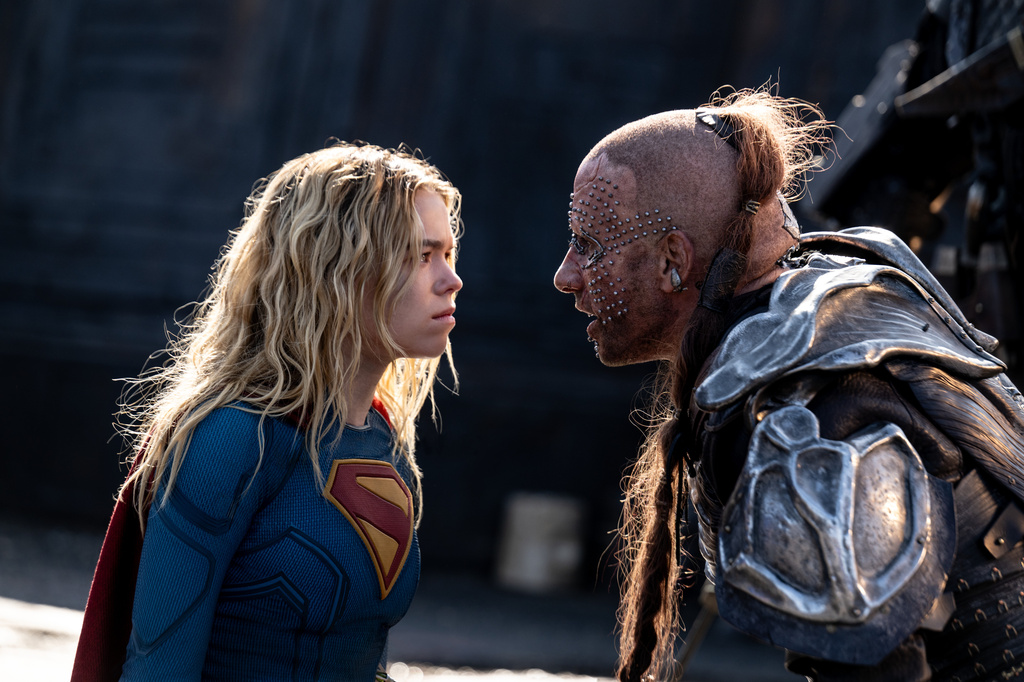 This image released by Warner Bros. Pictures shows Milly Alcock, left, and Matthias Schoenaerts in a scene from "Supergirl." (Warner Bros. Pictures via AP)