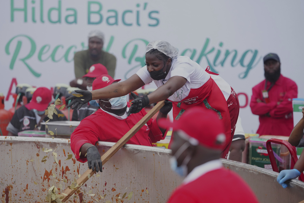 Chef Hilda Baci attempts to cook the world's largest pot of Jollof Rice in Lagos, Nigeria, on Friday, Sept 12, 2025. (AP Photo/Sunday Alamba)