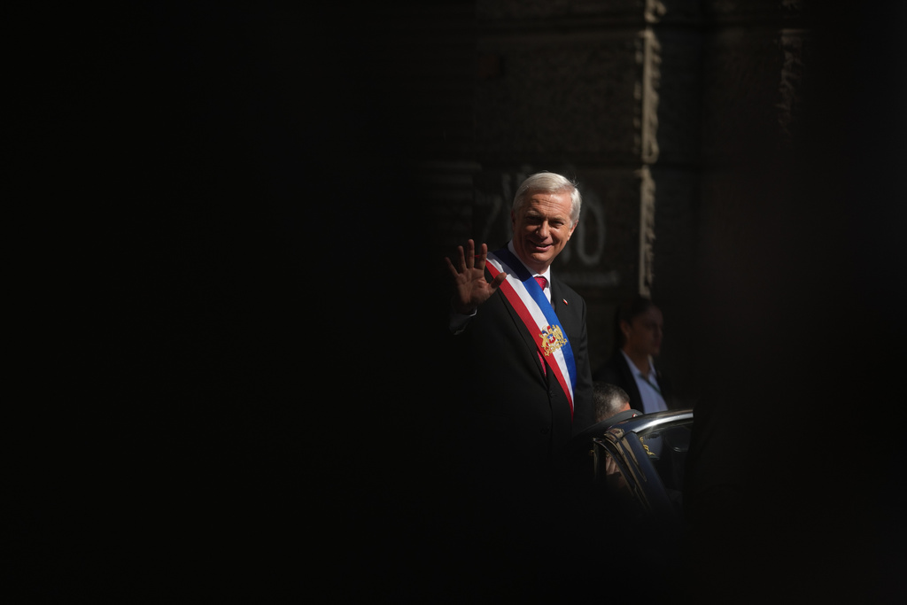 President Jose Antonio Kast leaves the presidential palace on his way to Mass the day after his inauguration in Santiago, Chile, Thursday, March 12, 2026. (AP Photo/Esteban Felix)