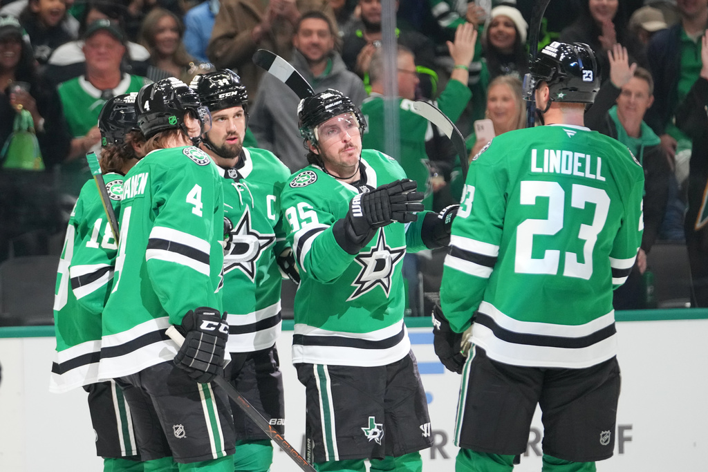 Dallas Stars players celebrate a first period goal by center Sam Steel, far left, during an NHL hockey game against the Utah Mammoth Monday, March 16, 2026, in Dallas. (AP Photo/Julio Cortez)