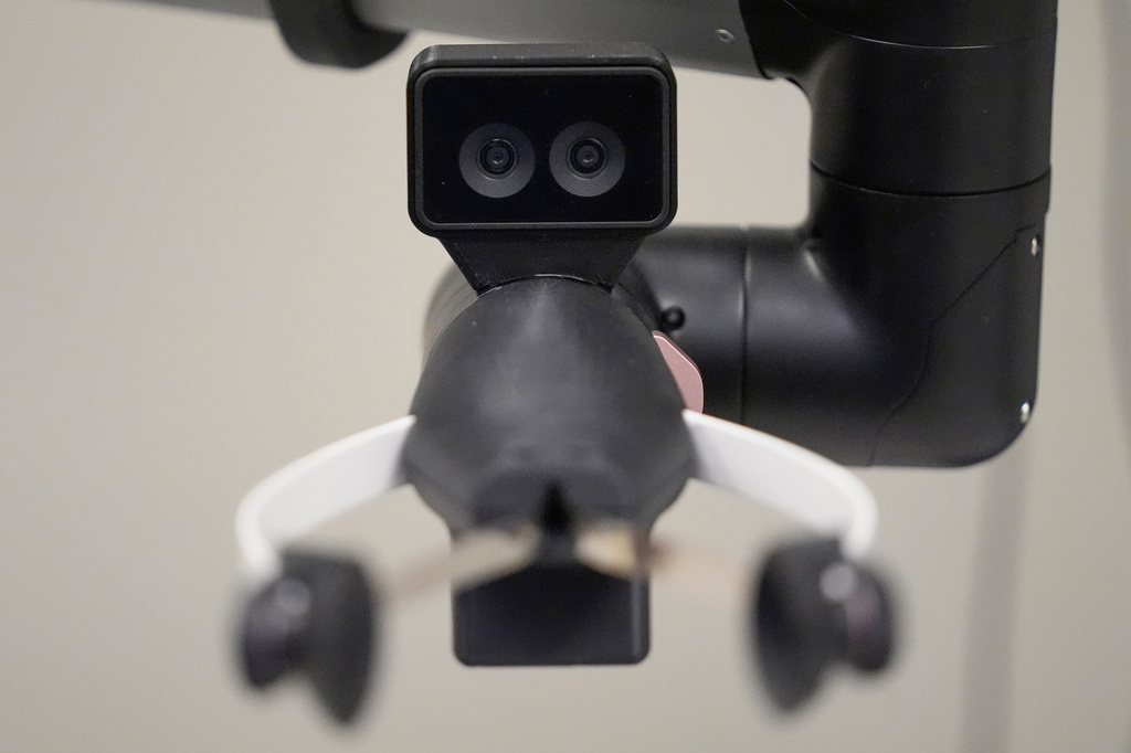 A camera on the hand of a Hello Robot uses two lenses for improved depth perception, during a demonstration at the University of New Hampshire, Tuesday, April 21, 2026, in Durham, N.H. (AP Photo/Robert F. Bukaty)
