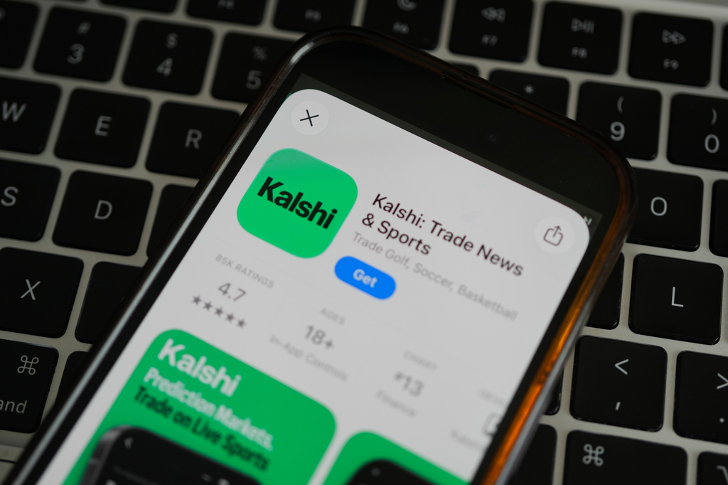 FILE - An ad for the prediction market app Kalshi is displayed on a mobile phone Thursday, April 16, 2026, in Chicago. (AP Photo/Erin Hooley,File)