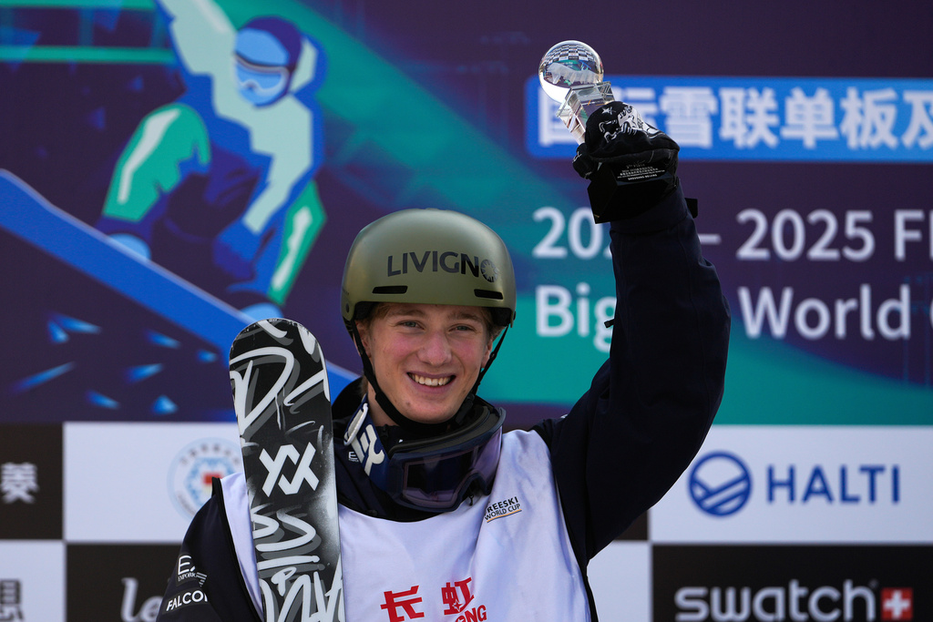 FILE - Silver medalist Miro Tabanelli of Italy celebrates on podium for the Men's Freeski Big Air final in the FIS Snowboard & Freeski World Cup 2025, at the Shougang Park in Beijing, Sunday, Dec. 1, 2024. (AP Photo/Andy Wong, File)