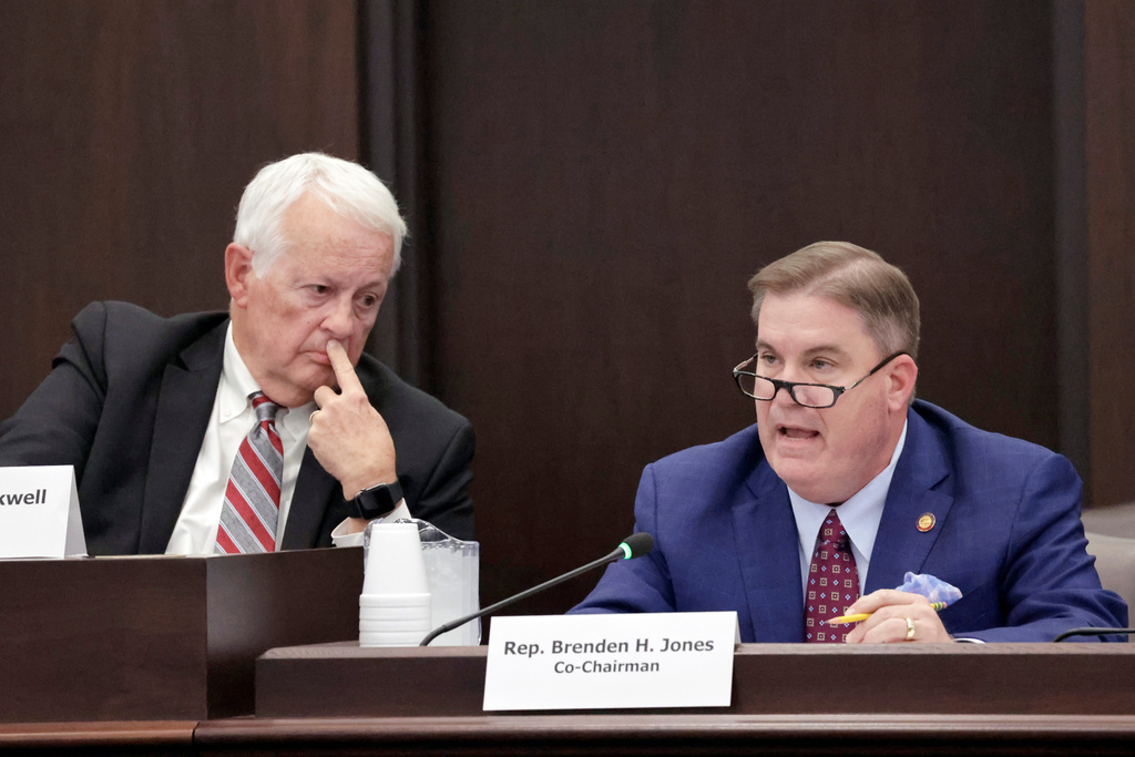 House Redistricting Committee Co-Chairs Rep. Hugh Blackwell, R- Burke, left, listens as Rep. Brenden Jones, R-Columbus, right, speaks during a committee meeting regarding a proposed redistricting map Tuesday, Oct. 21, 2025, in Raleigh, N.C. (AP Photo/Chris Seward)