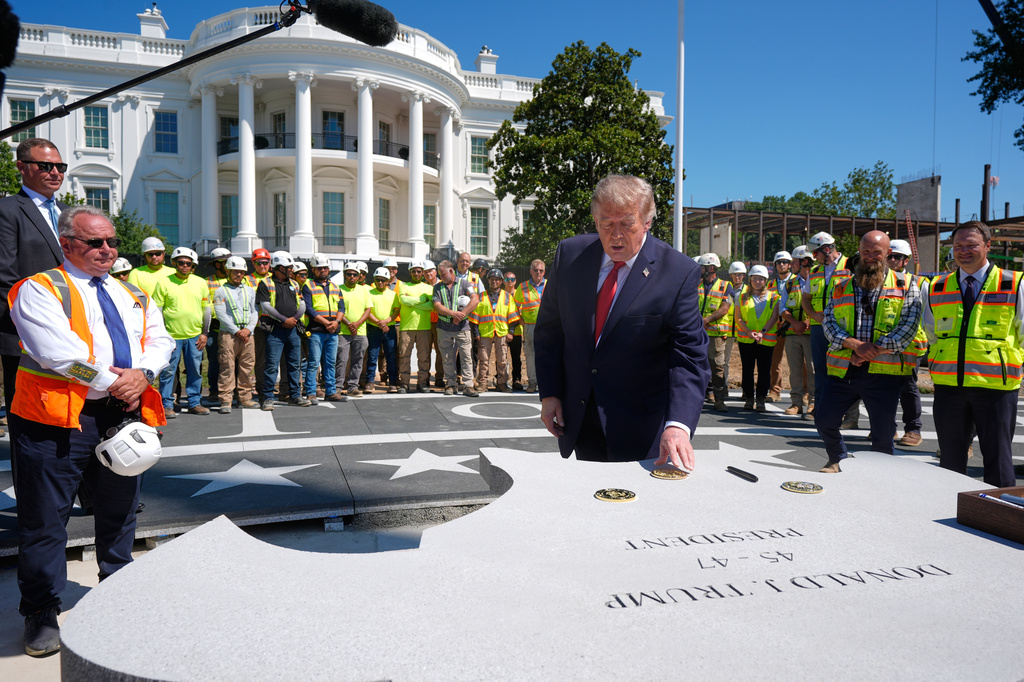 President Donald Trump speaks outside the White House, Wednesday, Aug. 19, 2026, in Washington, at the construction site of the new helicopter landing zone on the South Lawn of the White House. (AP Photo/Manuel Balce Ceneta)