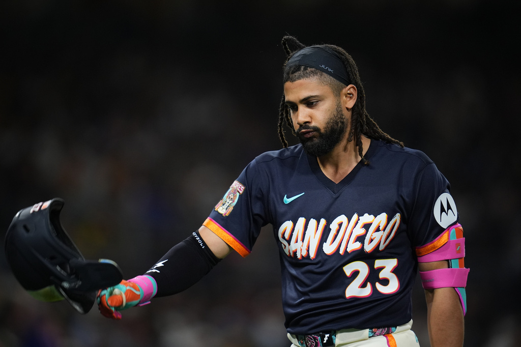 San Diego Padres' Fernando Tatis Jr. tosses his helmet after lining out during the eighth inning of a baseball game against the New York Mets Friday, June 5, 2026, in San Diego. (AP Photo/Gregory Bull)