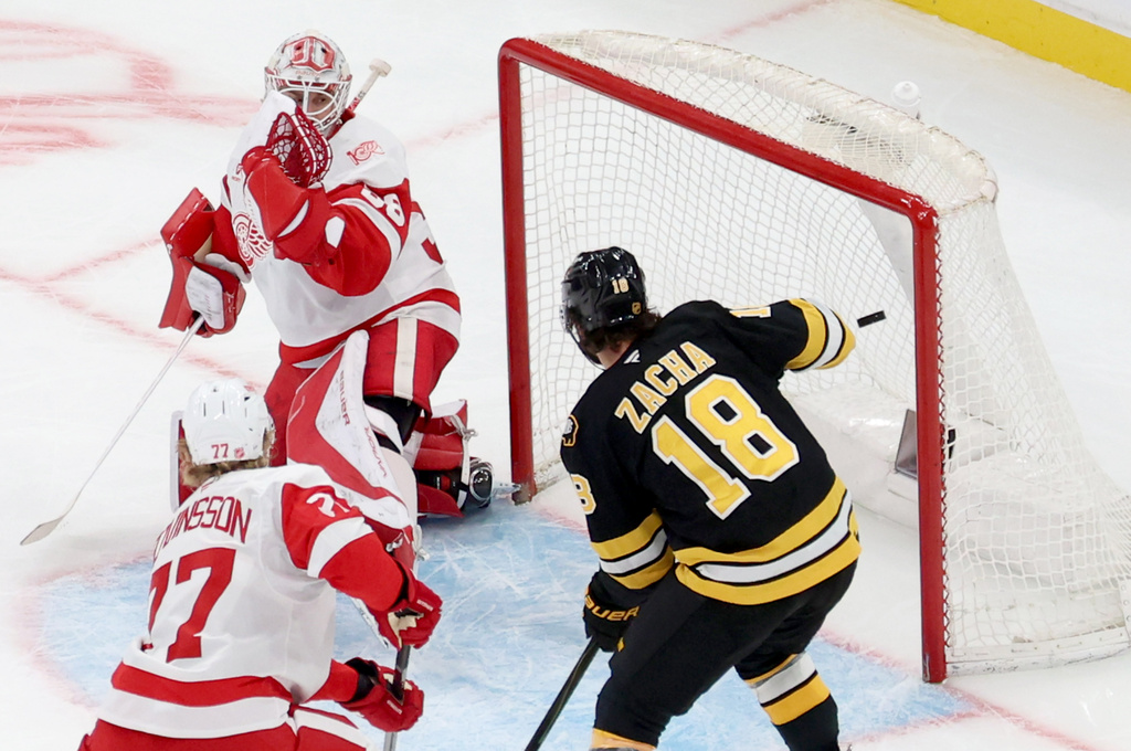 The puck passes Detroit Red Wings goaltender Cam Talbot (39) on a goal by Boston Bruins center Morgan Geekie during the third period of an NHL hockey game, Saturday, Nov. 29, 2025, in Boston. (AP Photo/Mark Stockwell)