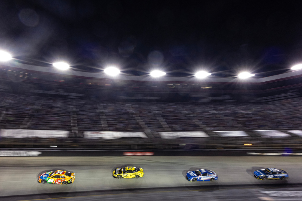 Ty Gibbs (54) leads Carson Hocevar (77), Kyle Larson (5), and Ryan Blaney (12) during a NASCAR Cup Series auto race Saturday, Sept. 19, 2026, in Bristol, Tenn. (AP Photo/Wade Payne)