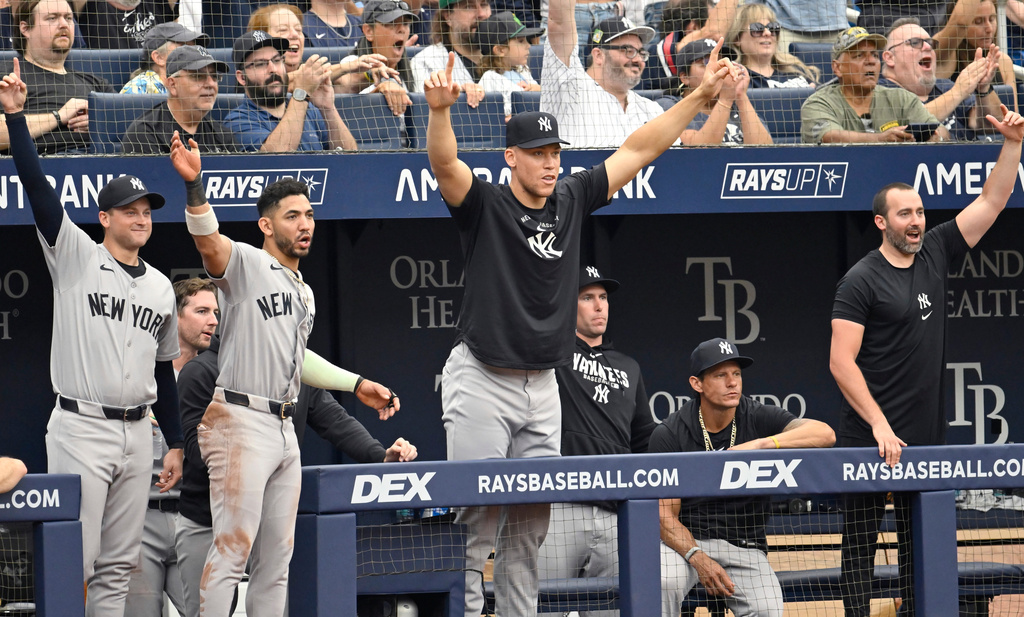 New York Yankees' Aaron Judge, center, celebrates Ben Rice's, not pictured, two-run home run during the third inning of a baseball game against the Tampa Bay Rays Thursday, July 9, 2026, in St. Petersburg, Fla. (AP Photo/Jason Behnken)