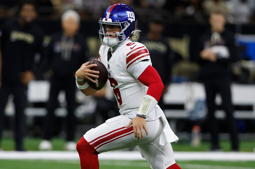 New York Giants quarterback Jaxson Dart (6) runs out of the pocket against the New Orleans Saints in the first half of an NFL football game, Sunday, Oct. 5, 2025, in New Orleans. (AP Photo/Butch Dill) New York Giants quarterback Jaxson Dart (6) runs out of the pocket against the New Orleans Saints in the first half of an NFL football game, Sunday, Oct. 5, 2025, in New Orleans. (AP Photo/Butch Dill)