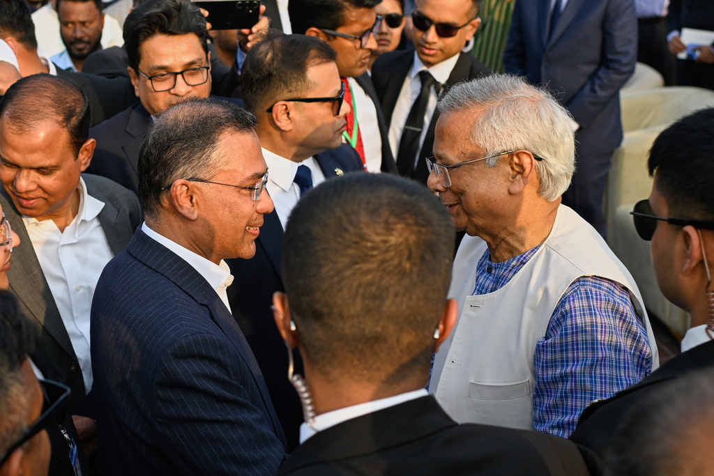 Chief Advisor of Bangladesh Professor Muhammad Yunus, right, congratulates Bangladesh's newly sworn in Prime Minister Tarique Rahman, after swearing in ceremony at the National Parliament in Dhaka, Bangladesh, Tuesday, Feb.17, 2026. (AP Photo/Mahmud Hossain Opu)