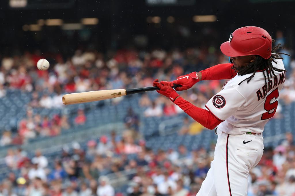 Washington Nationals' CJ Abrams hits a two-run home run off of Chicago Cubs pitcher Shota Imanaga which scored Brady House during the first inning of a baseball game in Washington, Tuesday, Aug 11, 2026. (AP Photo/Terrance Williams)
