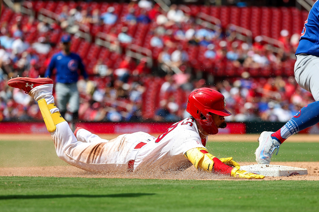 St. Louis Cardinals' Bryan Torres is out as he slides into first base during the sixth inning of a baseball game against the Chicago Cubs, Thursday, July 30, 2026, in St. Louis. (AP Photo/Scott Kane)