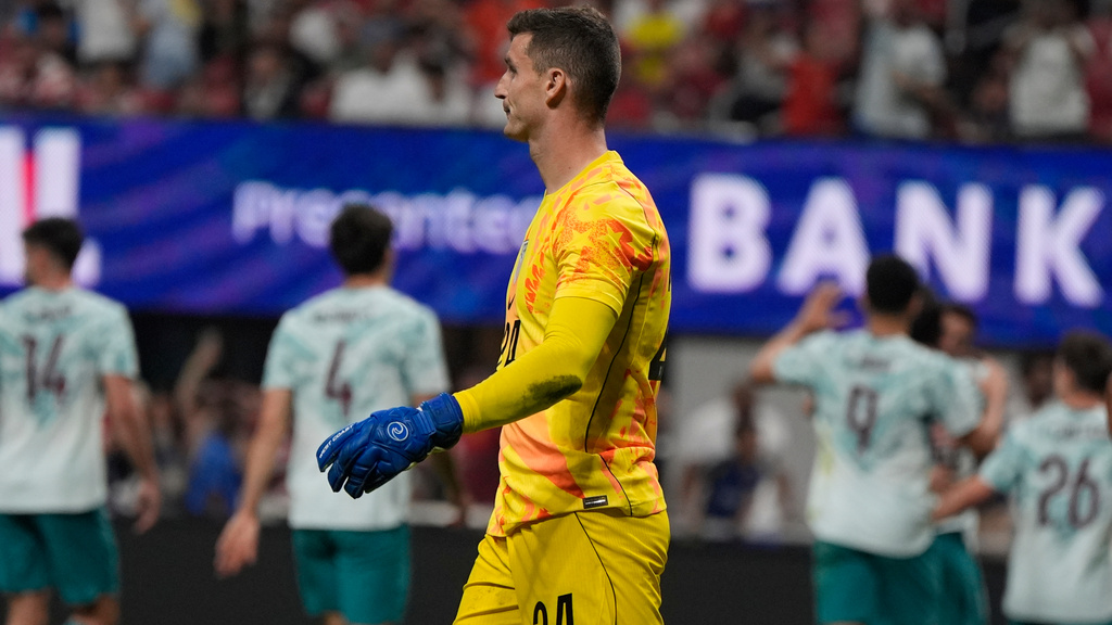 USA goalkeeper Matt Freese (24) walks after Portugal scored during the second half of an international friendly soccer match, Tuesday, March 31, 2026, in Atlanta. (AP Photo/Mike Stewart)