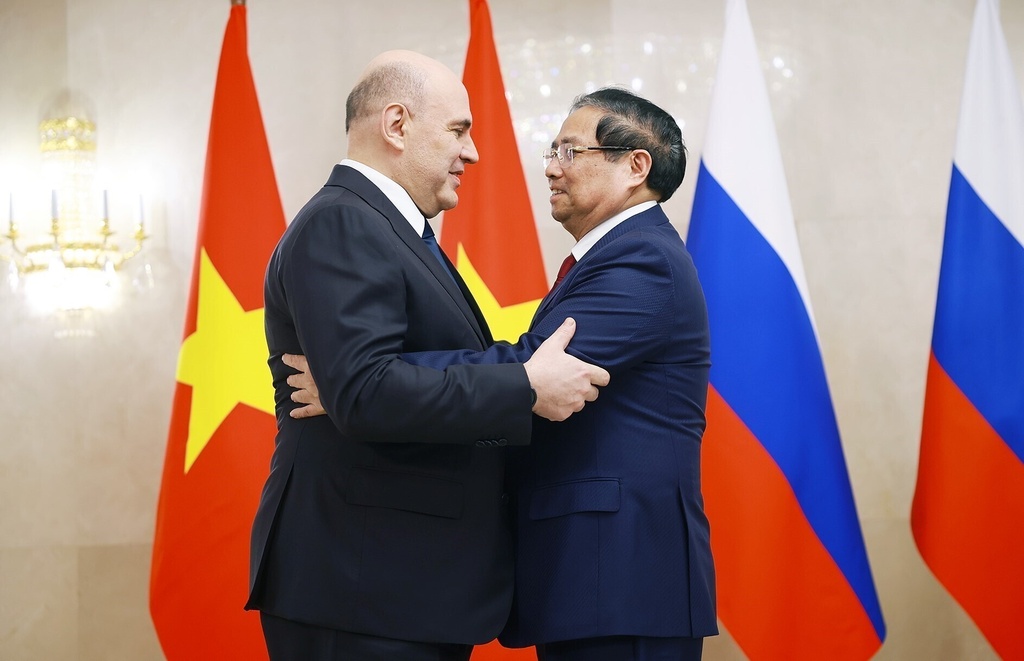 Vietnamese Prime Minister Pham Minh Chinh, right and Russian Prime Minister Mikhail Mishustin, hug during Chinh’s official visit in Moscow, Russia, March. 23, 2026. (Duong Van Giang/VNA via AP)