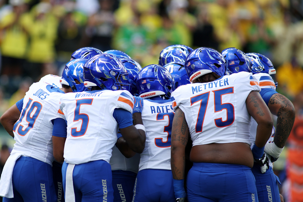 Boise State players group up during the first half of an NCAA college football game against Oregon, Saturday, Sept. 5, 2026, in Eugene, Ore. (AP Photo/Lydia Ely)