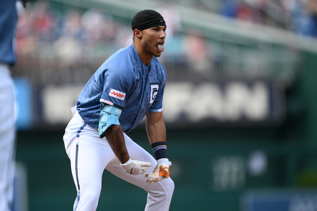Washington Nationals' Daylen Lile reacts at third base after he tripled during the first inning of a baseball game against the Seattle Mariners, Saturday, June 13, 2026, in Washington. (AP Photo/Nick Wass)