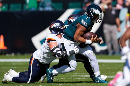 Denver Broncos linebacker Nik Bonitto and Broncos defensive end Zach Allen, left, bring down Philadelphia Eagles quarterback Jalen Hurts (1) during the first half of an NFL football game Sunday, Oct. 5, 2025, in Philadelphia. (AP Photo/Chris Szagola) Denver Broncos linebacker Nik Bonitto and Broncos defensive end Zach Allen, left, bring down Philadelphia Eagles quarterback Jalen Hurts (1) during the first half of an NFL football game Sunday, Oct. 5, 2025, in Philadelphia. (AP Photo/Chris Szagola)