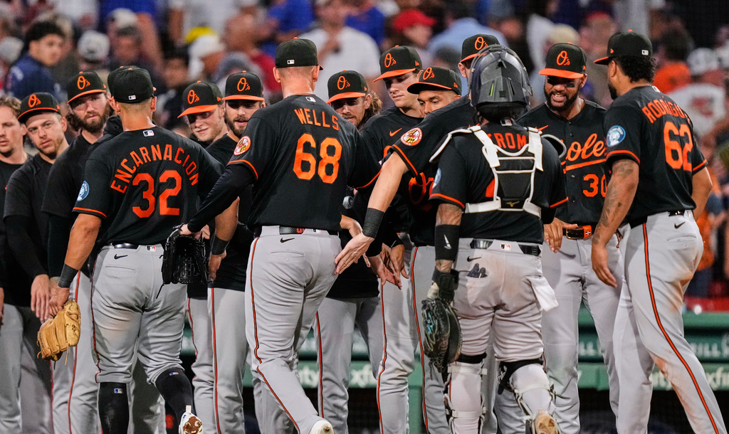 Baltimore Orioles celebrate after defeating the Boston Red Sox in second baseball game of a doubleheader against the Baltimore Orioles, Wednesday, July 22, 2026, in Boston. (AP Photo/Charles Krupa)