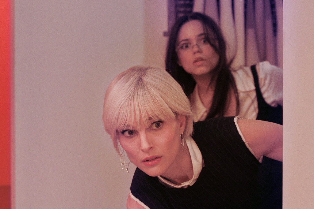 Natalie Portman, foreground, and Jenna Ortega appear in a scene from "The Gallerist," an official selection of the 2026 Sundance Film Festival. (MRC II Distribution Company L.P./Sundance Institute via AP)