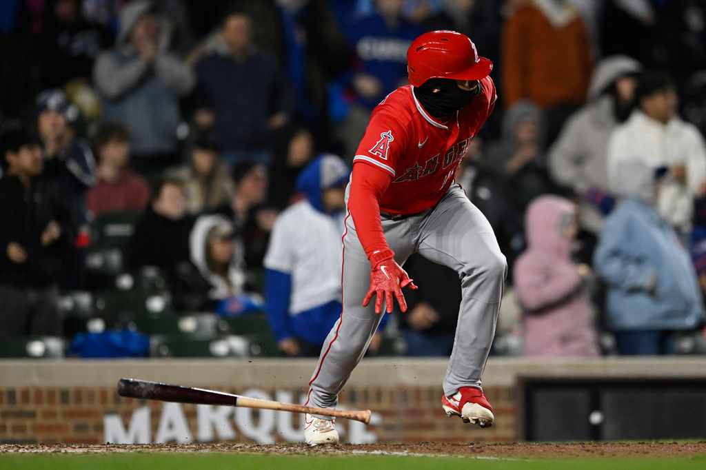 Los Angeles Angels' Logan O'Hoppe watches his two-run single during the sixth inning of a baseball game against the Chicago Cubs in Chicago, Tuesday, March 31, 2026. (AP Photo/Paul Beaty)