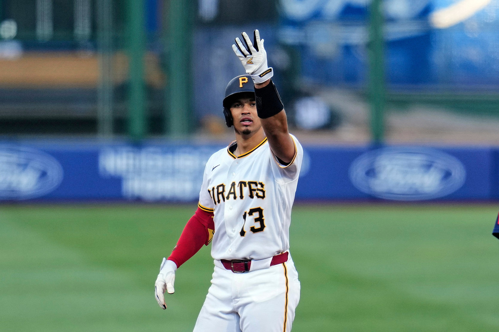 Pittsburgh Pirates' Endy Rodríguez celebrates as he stands on second after driving in two runs with a double off Seattle Mariners pitcher Bryan Woo, during the fourth inning of a baseball game in Pittsburgh, Wednesday, June 24, 2026. (AP Photo/Gene J. Puskar)