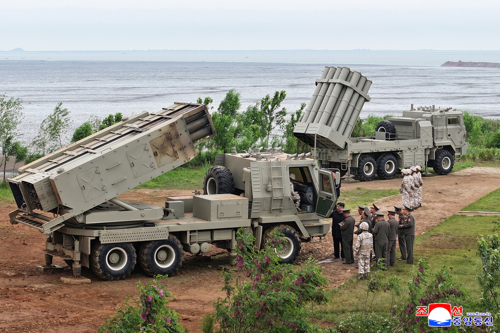 In this photo provided by the North Korean government, its leader Kim Jong Un, center right, inspects the multiple weapons systems, at an undisclosed location, North Korea, Tuesday, May 26, 2026. Independent journalists were not given access to cover the event depicted in this image distributed by the North Korean government. The content of this image is as provided and cannot be independently verified. Korean language watermark on image as provided by source reads: "KCNA" which is the abbreviation for Korean Central News Agency. (Korean Central News Agency/Korea News Service via AP)