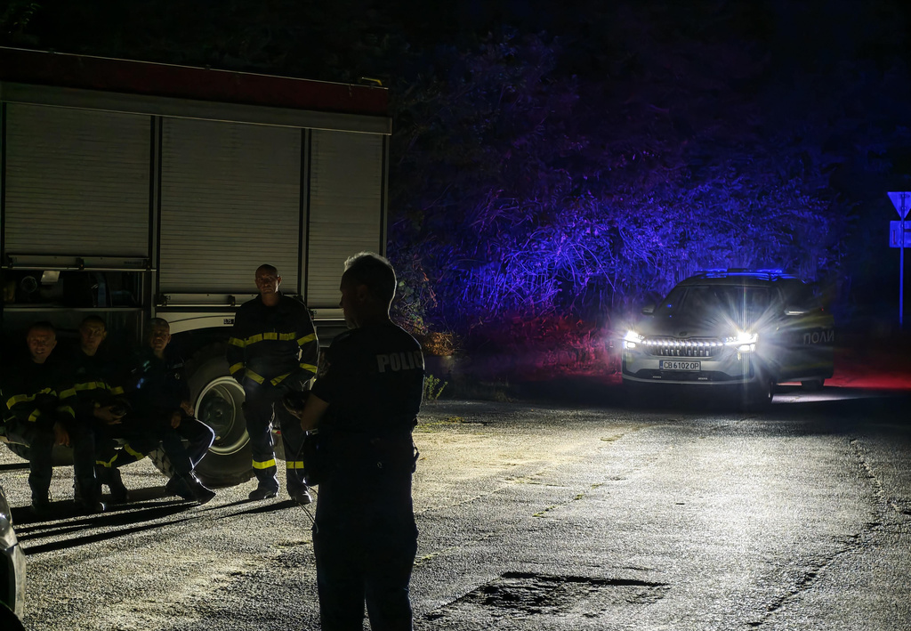 Police and fire department near Tsareva Livada, Bulgaria, Saturday, Sept. 12, 2026 as Bulgarian authorities launched investigations in an explosion at a weapons storage site in central Bulgaria overnight, which came in the wake of another blaze at a munition's depot in the last weeks. (AP Photo/BGNES Agency)