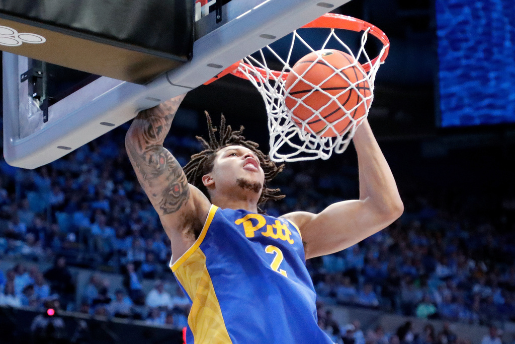 FILE - Pittsburgh forward Cameron Corhen dunks against North Carolina during the second half of an NCAA college basketball game, Feb. 8, 2025, in Chapel Hill, N.C. (AP Photo/Chris Seward, File)