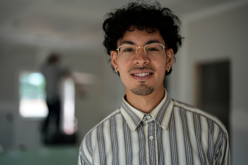 Home owner Oswaldo Herrera poses for a photo in his new home in Langston Park, April 13, 2026, in Atlanta. (AP Photo/Mike Stewart)