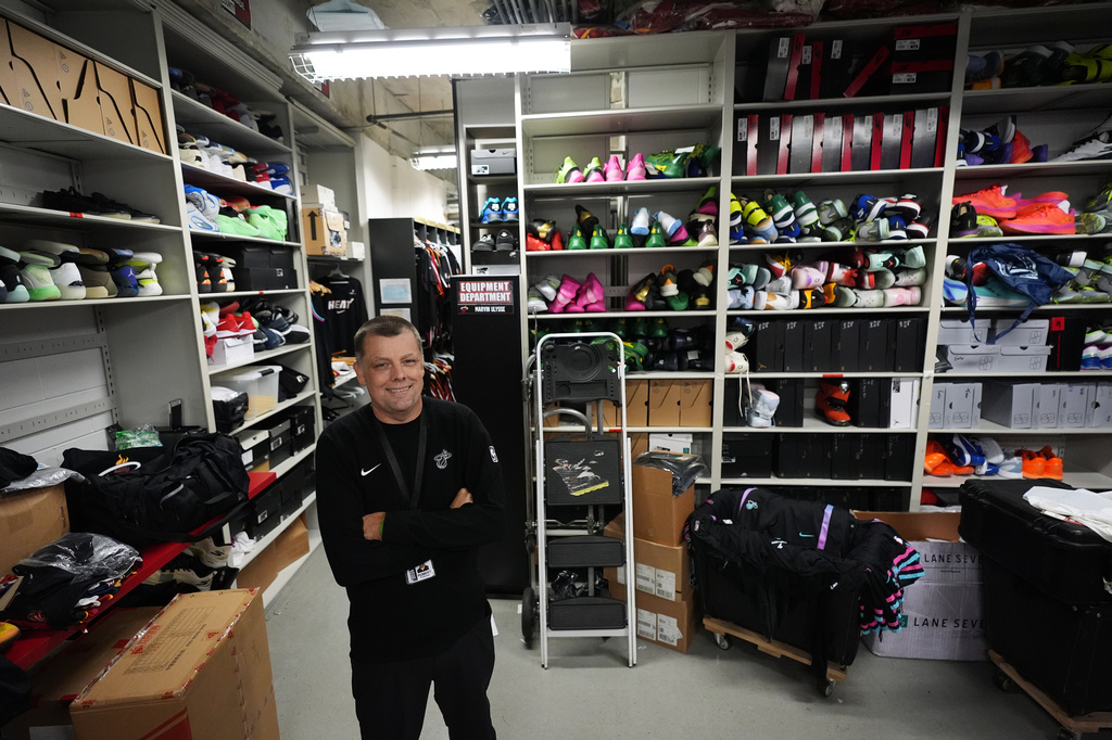 Rob Pimental, Miami Heat's director of team operations, poses for a picture in the team's equipment room following an NBA basketball game between the Miami Heat and the Atlanta Hawks, Sunday, April 12, 2026, in Miami. (AP Photo/Rebecca Blackwell)