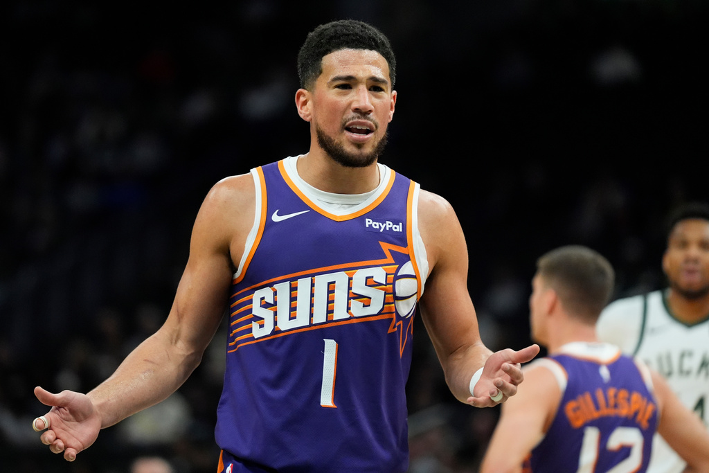 Phoenix Suns' Devin Booker reacts to a call during the first half of an NBA basketball game against the Milwaukee Bucks, Tuesday, March 10, 2026, in Milwaukee. (AP Photo/Aaron Gash)