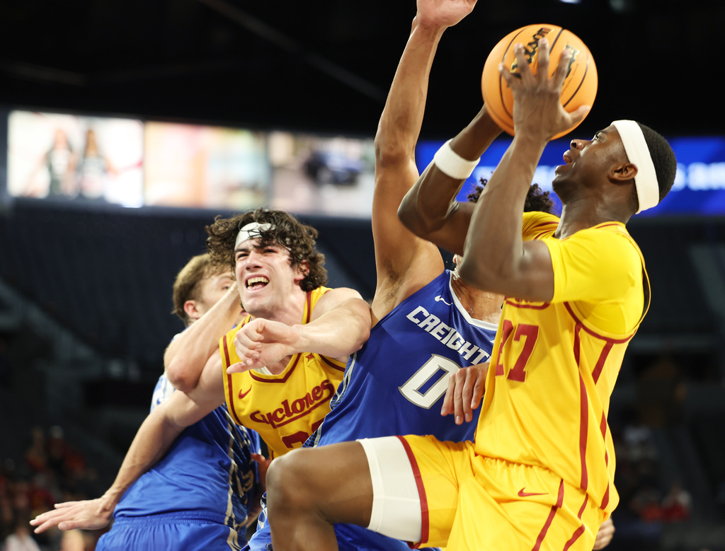 Iowa State guard Killyan Toure (27) goes for a layup near Creighton forward Jasen Green (0) during the first half of an NCAA college basketball game Tuesday, Nov. 25, 2025, in Las Vegas. (AP Photo/Ronda Churchill)