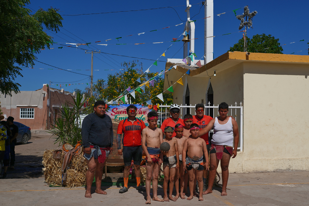The Osuna family poses for a photo before a match of ulama, a traditional Mesoamerican ballgame dating to pre-Hispanic times, that they organized in Los Llanitos on the outskirts of Mazatlan, Mexico, Saturday, April 25, 2026. (AP Photo/Marco Ugarte)