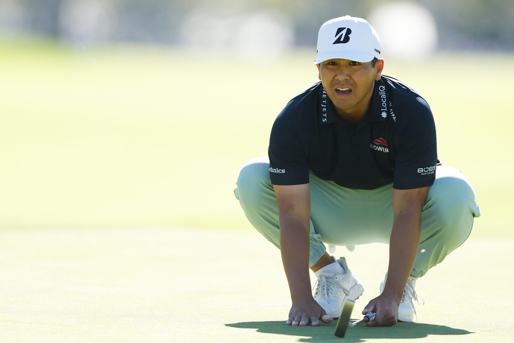Kurt Kitayama measures his putt on the 17th green during the final round of the Genesis Invitational golf tournament at Riviera Country Club, Sunday, Feb. 22, 2026, in the Pacific Palisades area of Los Angeles. (AP Photo/Caroline Brehman )