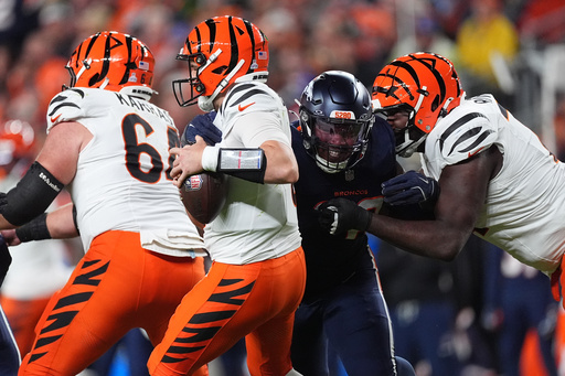 Denver Broncos defensive end John Franklin-Myers (98) sacks Cincinnati Bengals quarterback Jake Browning (6) during the second half of an NFL football game Monday, Sept. 29, 2025, in Denver. (AP Photo/David Zalubowski) Denver Broncos defensive end John Franklin-Myers (98) sacks Cincinnati Bengals quarterback Jake Browning (6) during the second half of an NFL football game Monday, Sept. 29, 2025, in Denver. (AP Photo/David Zalubowski)