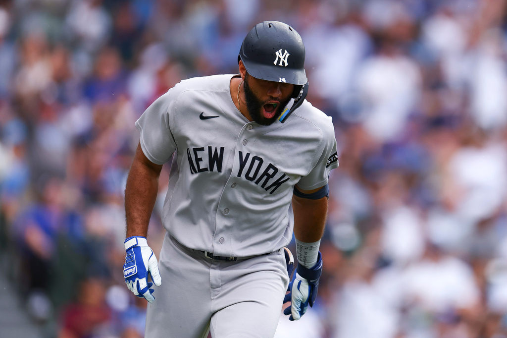 New York Yankees' Amed Rosario reacts after hitting a home run during the fourth inning of a baseball game against the Chicago Cubs in Chicago, Friday, July 31, 2026. (AP Photo/Jessie Alcheh)
