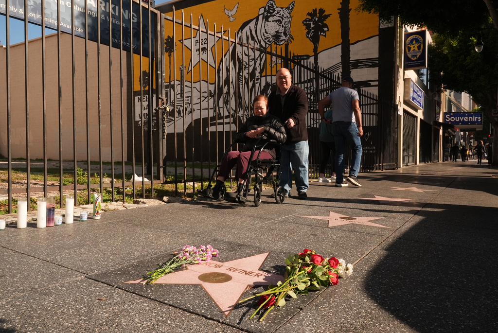 Flowers cover the Walk of Fame star for Rob Reiner Monday, Dec. 15, 2025, in the Hollywood section of Los Angeles. (AP Photo/Damian Dovarganes)