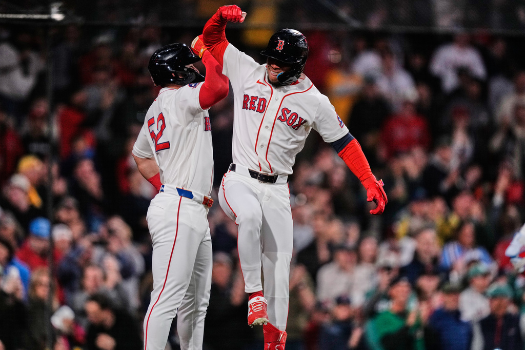Boston Red Sox's Ceddanne Rafaela, right, celebrates with Wilyer Abreu after his two-run home run during the sixth inning of a baseball game against the Philadelphia Phillies, Wednesday, May 13, 2026, in Boston. (AP Photo/Charles Krupa)