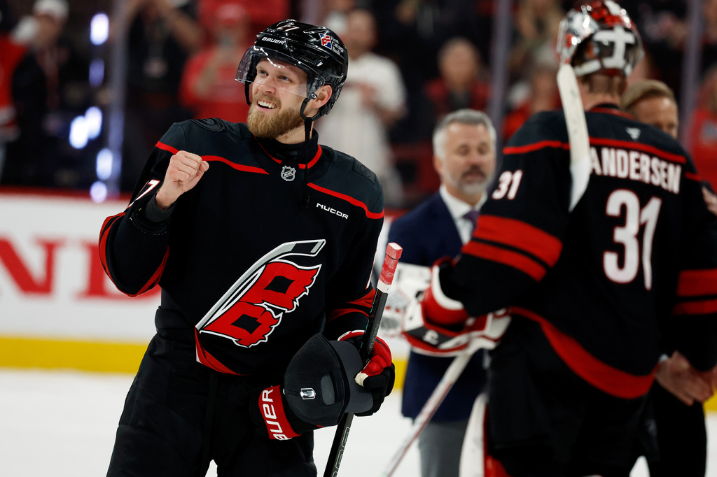 Carolina Hurricanes' Nikolaj Ehlers, left, celebrates following Game 5 of the Eastern Conference finals NHL hockey Stanley Cup playoff series against the Montreal Canadiens in Raleigh, N.C., Friday, May 29, 2026. (AP Photo/Karl DeBlaker)
