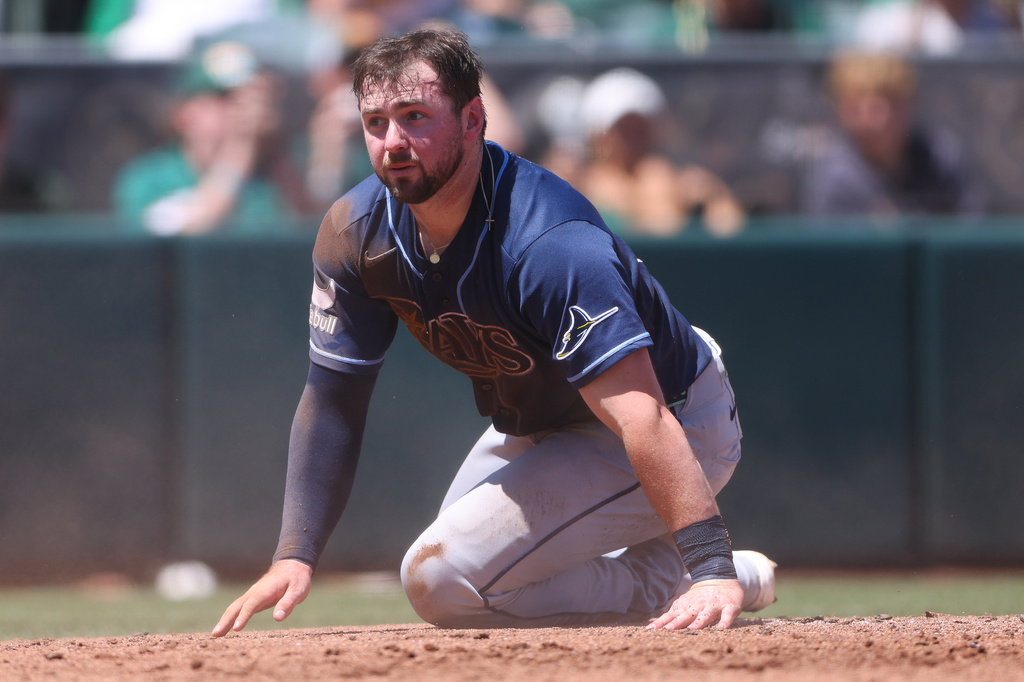 Tampa Bay Rays' Liam Hicks looks on after being tagged out at home plate attempting to score on an RBI double by Tampa Bay Rays Cedric Mullins, not shown, during the third inning of a baseball game against the Athletics, Wednesday, Aug. 12, 2026, in West Sacramento, Calif. (AP Photo/Scott Marshall)