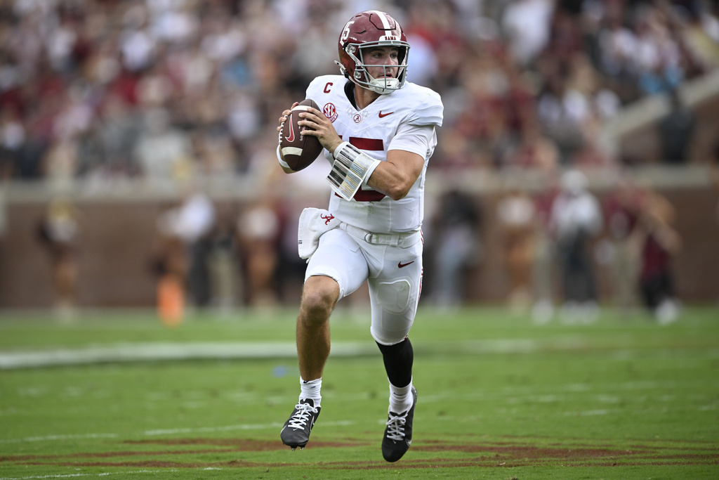 Alabama quarterback Ty Simpson looks for a receiver during the first half of an NCAA college football game against Florida State, Saturday, Aug. 30, 2025, in Tallahassee, Fla. (AP Photo/Phelan M. Ebenhack)