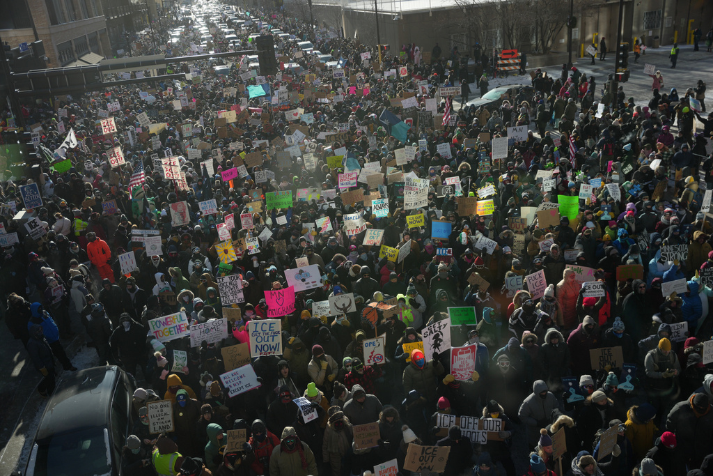 People protest against Federal immigration agents on Friday, Jan. 23, 2026, in Minneapolis. (AP Photo/Angelina Katsanis)