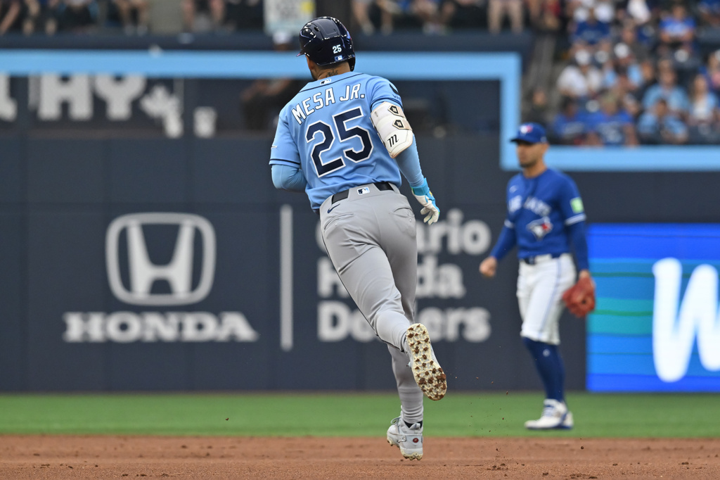 Tampa Bay Rays' Victor Mesa Jr. (25) runs the bases after hitting a solo home run against the Toronto Blue Jays during the second inning of a baseball game in Toronto, Monday, July 20, 2026. (Jon Blacker/The Canadian Press via AP)