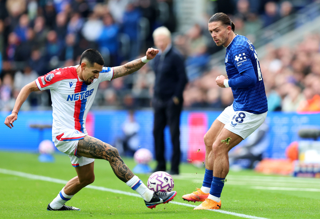 Crystal Palace's Daniel Munoz, left, and Everton's Jack Grealish battle for the ball during the English Premier League soccer match at the Hill Dickinson Stadium, Liverpool, England, Sunday, Oct. 5, 2025. (Nigel French/PA via AP)