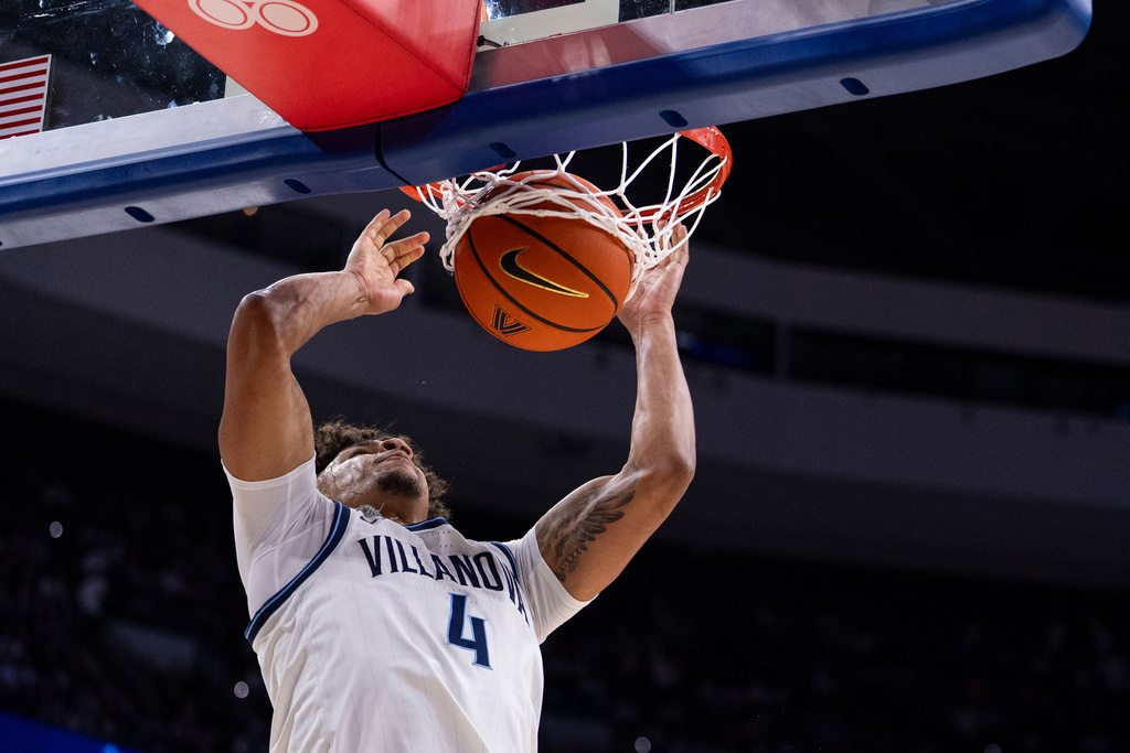 Villanova's Tyler Perkins dunks during the first half of an NCAA college basketball game against UConn, Saturday, Feb. 21, 2026, in Philadelphia. (AP Photo/Chris Szagola)